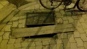 An open manhole, rendered safe